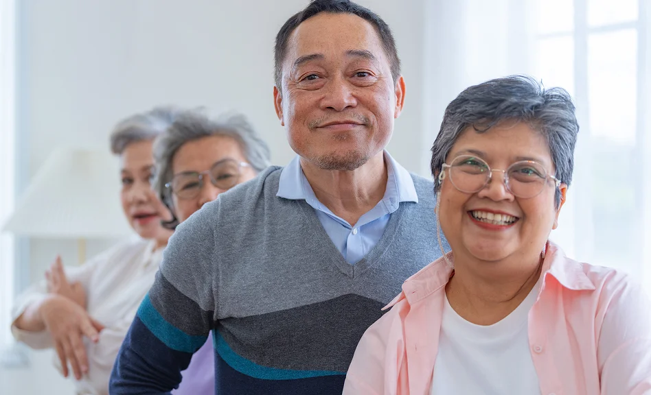 Senior men and women enjoying a wellness class together